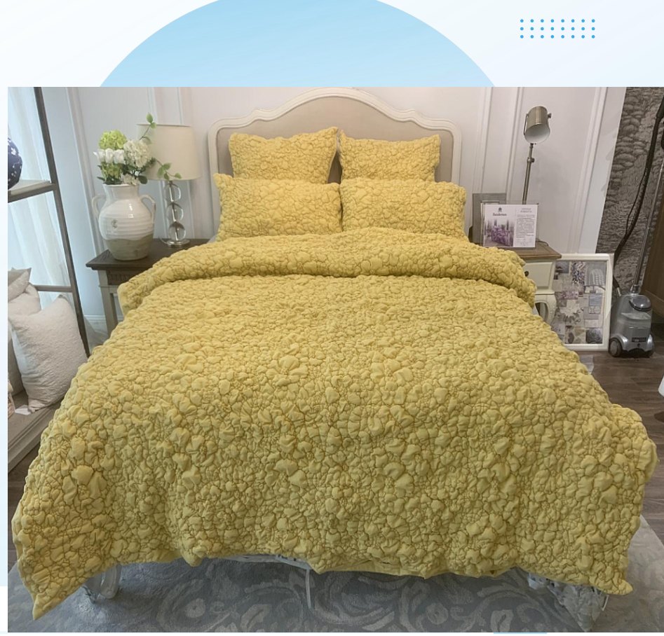 Textured comforter set displayed in the WISH TEXTILE showroom